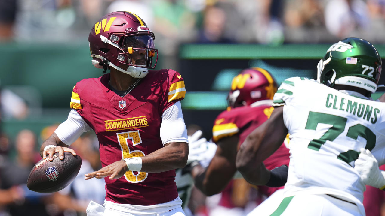 Jayden Daniels threw a beautiful deep ball for his first NFL completion. (Photo by Mitchell Leff/Getty Images)