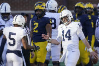 Penn State quarterback Sean Clifford (14) celebrates his team's win over Michigan with wide receiver Jahan Dotson (5) after an NCAA college football game, Saturday, Nov. 28, 2020, in Ann Arbor, Mich. (AP Photo/Carlos Osorio)