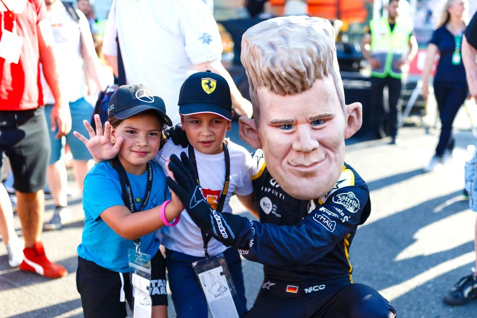 Wave goodbye to Germany? Nico Hulkenberg (sort of) with some young German fans at the Hockenheimring. They’re not wearing his hat though…