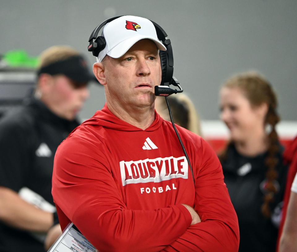 Sep 29, 2023; Raleigh, North Carolina, USA; Louisville Cardinals head coach Jeff Brohm watches the coin toss prior to the game against the North Carolina State Wolfpack at Carter-Finley Stadium. Mandatory Credit: Rob Kinnan-USA TODAY Sports
