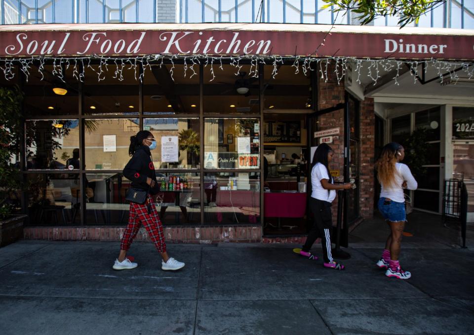 Customers outside Dulan's Soul Food Kitchen in Inglewood