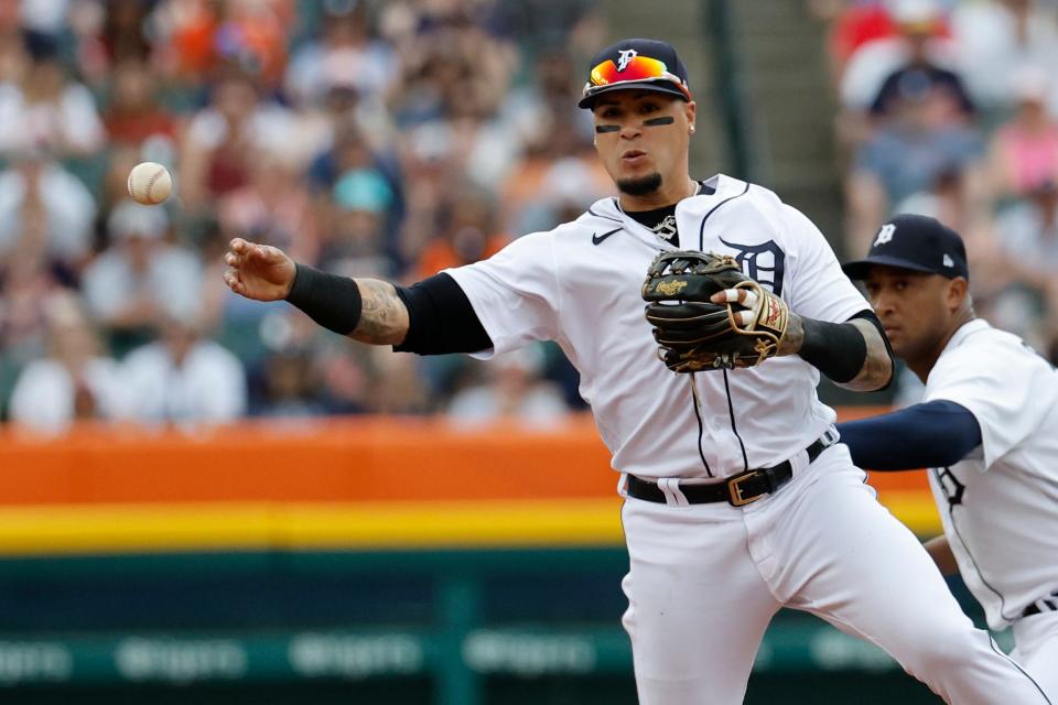 Tigers shortstop Javier Baez makes a throw to first in the second inning May 14, 2022 against the Orioles at Comerica Park in Detroit.