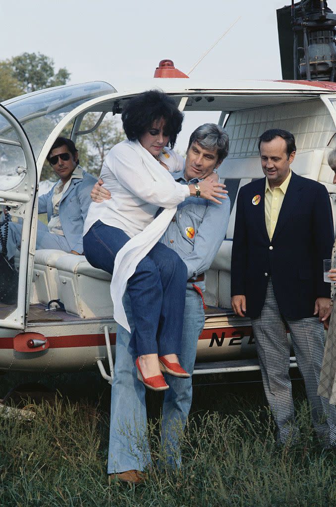 john warner carrying elizabeth taylor