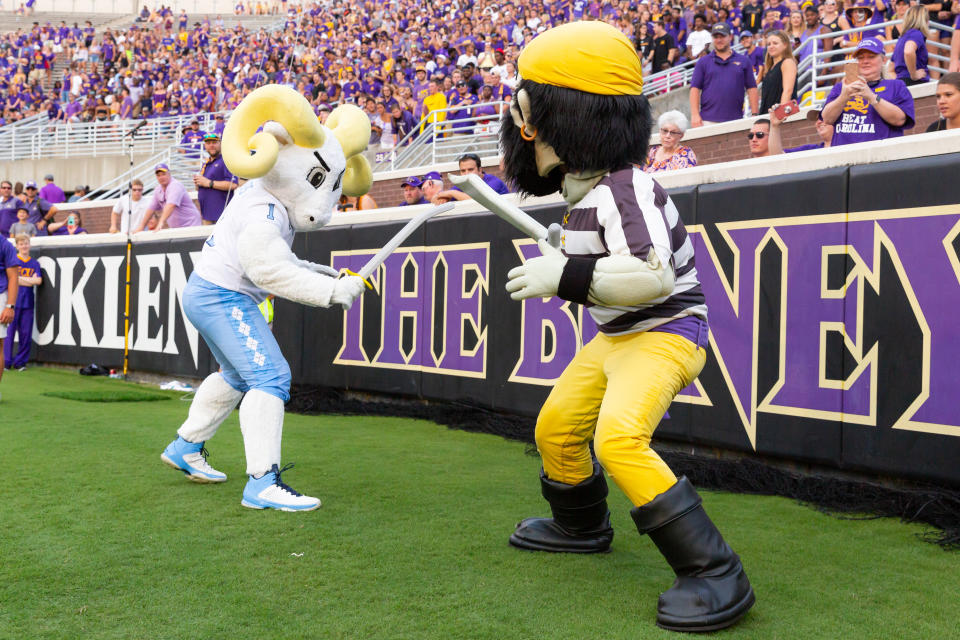 GREENVILLE, NC - SEPTEMBER 08: The North Carolina Tar Heels mascot has a sword fight with the East Carolina Pirates mascot during a game between the North Carolina Tar Heels and the East Carolina Pirates on September 8, 2018, at the Dowdy-Ficklen Stadium in Greenville, North Carolina. East Carolina won the sword fight and the game by a score of 41-19. (Photo by Jay Anderson/Icon Sportswire via Getty Images)