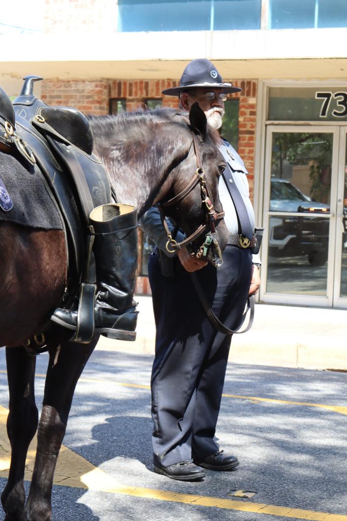 Pineville City Deputy Marshal Thomas Ray holds the reins of his riderless horse, River, Friday at the 24th annual Law Enforcement Memorial in downtown Alexandria.
