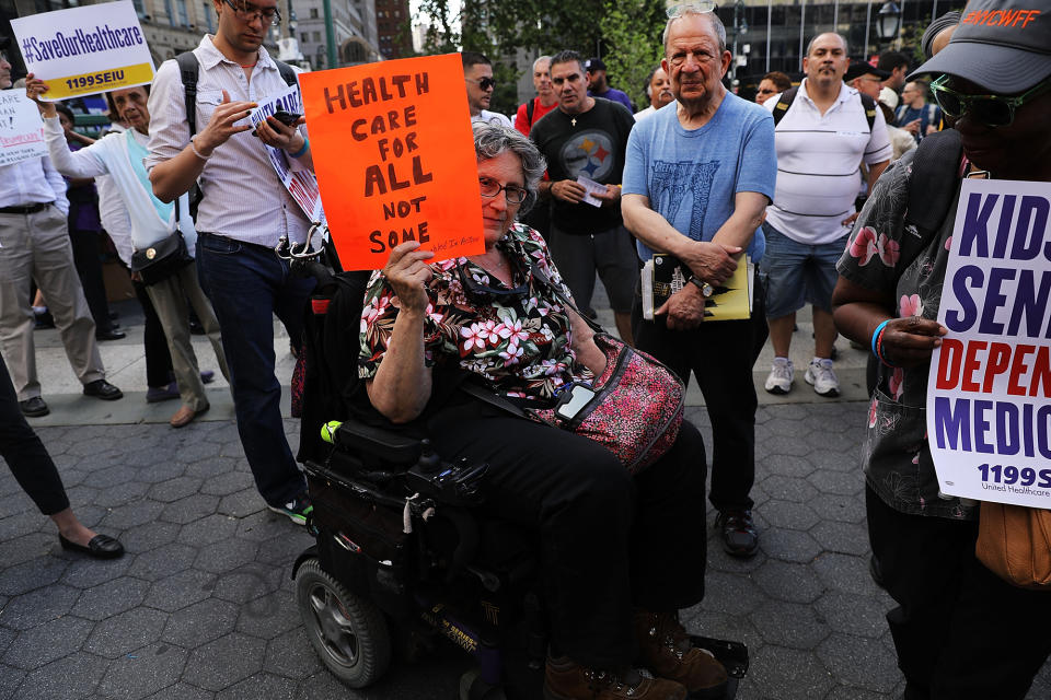 <p>Jean Ryan from Disabled in Action joins others in protesting against the Senate healthcare bill on June 28, 2017 in New York City. (Photo: Spencer Platt/Getty Images) </p>