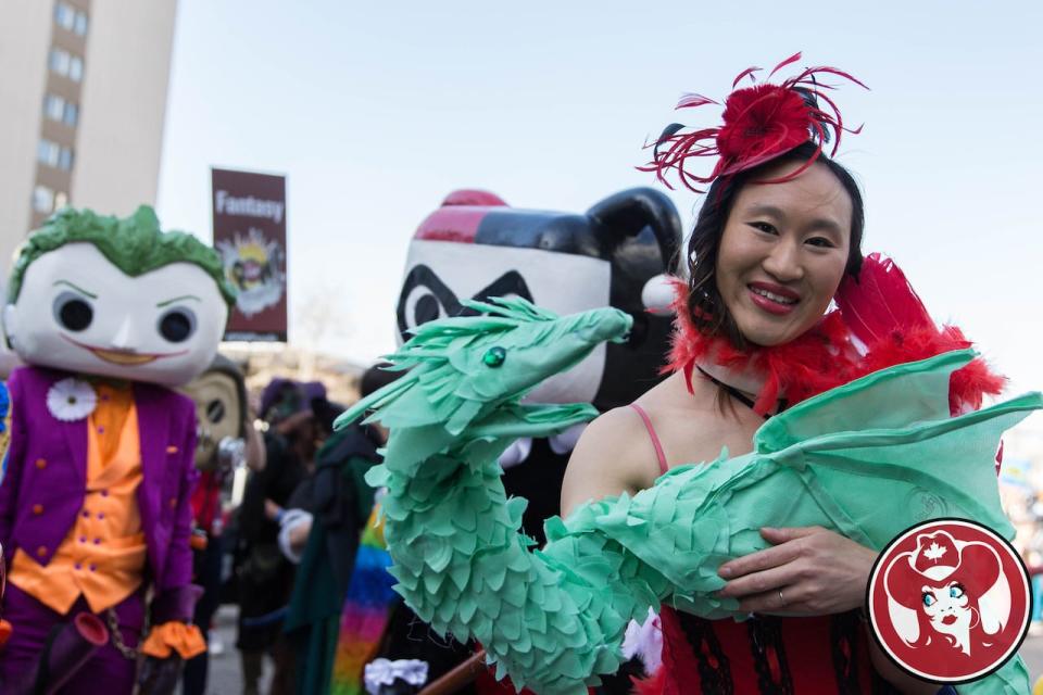 Diane Fung holds her handmade puppet, Levi the Leviathan, at a previous year's Parade of Wonders. Levi is made entirely out of recycled bags.