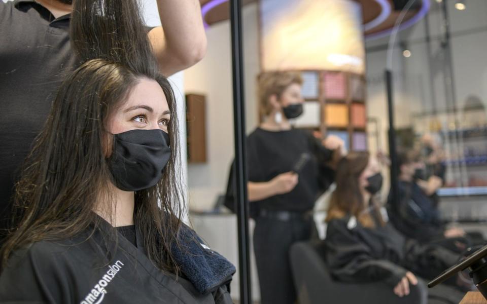 A person has their hair done in Amazon's new beauty salon in east London  - Amazon