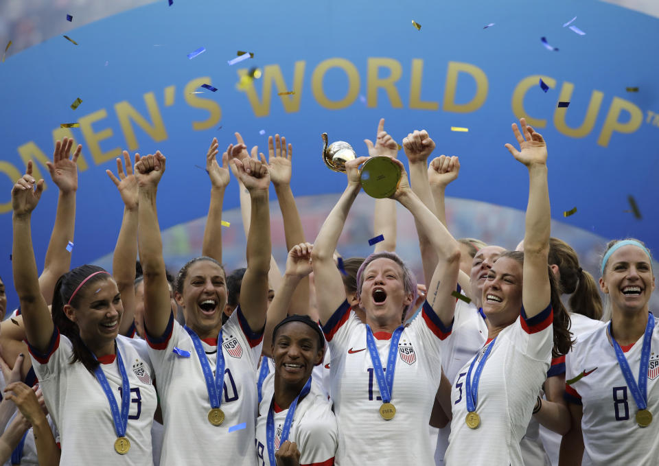 United States' Megan Rapinoe lifts up a trophy after winning the Women's World Cup final soccer match between US and The Netherlands at the Stade de Lyon in Decines, outside Lyon, France, Sunday, July 7, 2019. (AP Photo/Alessandra Tarantino)