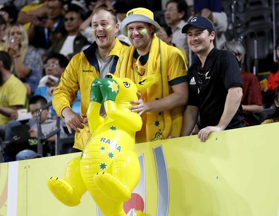 Fans wait for the start of the Rugby World Cup Pool D game at Sapporo Dome between Australia and Fiji in Sapporo, Japan, Saturday, Sept. 21, 2019. (AP Photo/Aaron Favila)