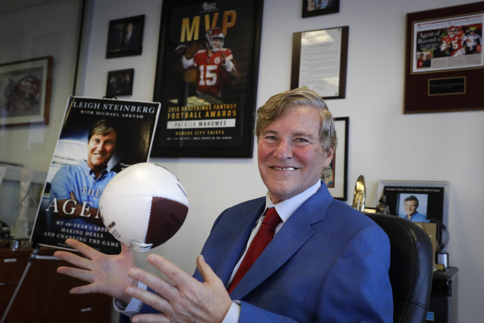 Sports agent Leigh Steinberg poses for a picture at his office Thursday, Feb. 13, 2020, in Newport Beach, Calif. A decade after his personal and professional life bottomed out, Steinberg has another Super Bowl MVP client, saw another former client be elected to the Pro Football Hall of Fame and could have yet another first-round draft pick in the spring. (AP Photo/Chris Carlson)