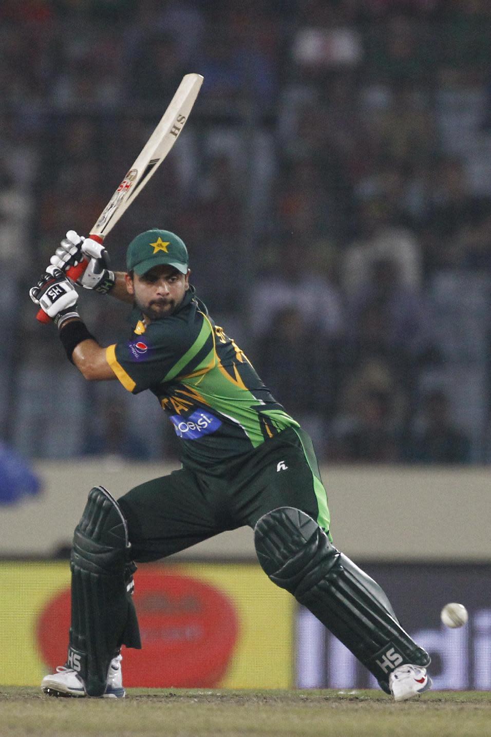 Pakistan’s Ahmed Shehzad plays a shot during their match against Bangladesh in the Asia Cup one-day international cricket tournament in Dhaka, Bangladesh, Tuesday, March 4, 2014. (AP Photo/A.M. Ahad)