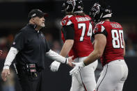 Atlanta Falcons head coach Dan Quinn speaks to players during the first half of an NFL football game against the Jacksonville Jaguars, Sunday, Dec. 22, 2019, in Atlanta. (AP Photo/John Bazemore)