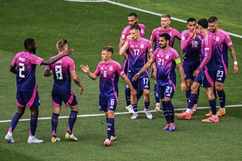 Germany's Jamal Musiala (3rd R) celebrates scoring his side's first goal with teammates during the UEFA Euro 2024 group A soccer match between Germany and Hungary at Stuttgart Arena. Bernd Weißbrod/dpa