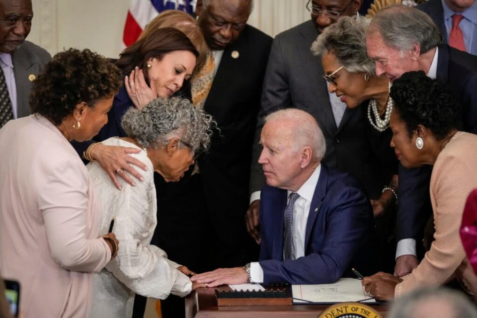 From left, In the embrace of Vice President Kamala Harris, 94-year-old activist and retired educator Opal Lee, known as the grandmother of Juneteenth, speaks with President Joe Biden after he signed the Juneteenth National Independence Day Act into law in the East Room of the White House on June 17, 2021, in Washington, D.C. (Photo: Drew Angerer/Getty Images)