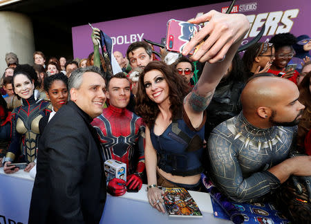 Director Anthony Russo poses with fans on the red carpet at the world premiere of the film "The Avengers: Endgame" in Los Angeles, California, April 22, 2019. REUTERS/Mario Anzuoni