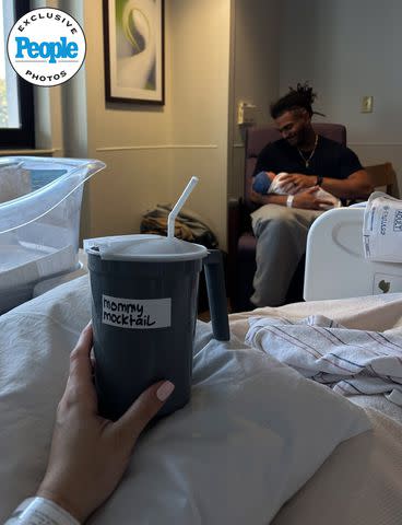 <p>Courtesy of Fred and Sydney Warner</p> Sydney Warner shares view from her hospital bed as husband Fred Warner holds their newborn son, Beau Anthony