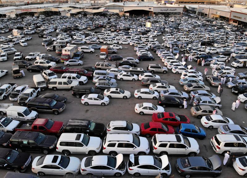 People gather to buy cars before the expected increase of VAT to 15% in Riyadh
