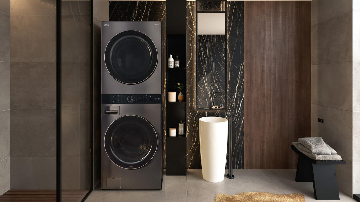  LG washer and dryer tower configuration in a black modern bathroom. 