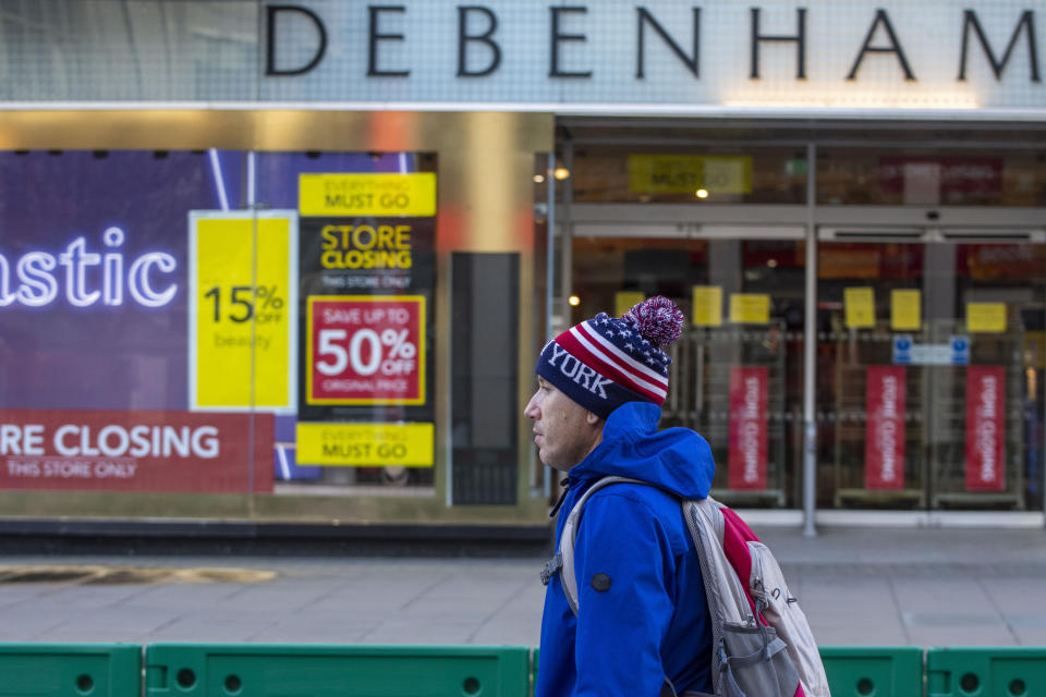 LONDON, UNITED KINGDOM - 2020/12/27: A man walks past a Closed Debenhams Store in Oxford Street. Under tier four restrictions, pubs and restaurants will close, as well as non-essential retail. (Photo by Pietro Recchia/SOPA Images/LightRocket via Getty Images)