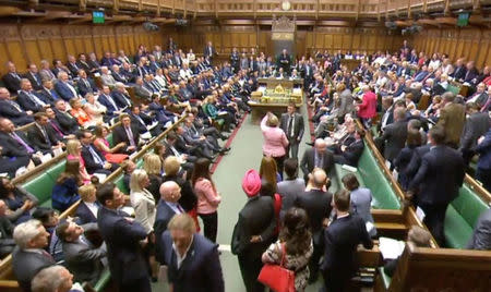 Members of Parliament for the Scottish National Party (SNP) walk out of the House of Commons during Prime Minister's Questions after their leader Ian Blackford was asked to leave by the Speaker, in London, Britain, June 13, 2018. Parliament TV handout via REUTERS