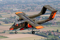 An OV-10 Bronco aircraft, decorated with World War One commemoration motifs, flies over Flanders international airport, ahead of the world's first Short Take Off & Landing competition on sand, in Wevelgem, Belgium May 8, 2018. REUTERS/Francois Lenoir