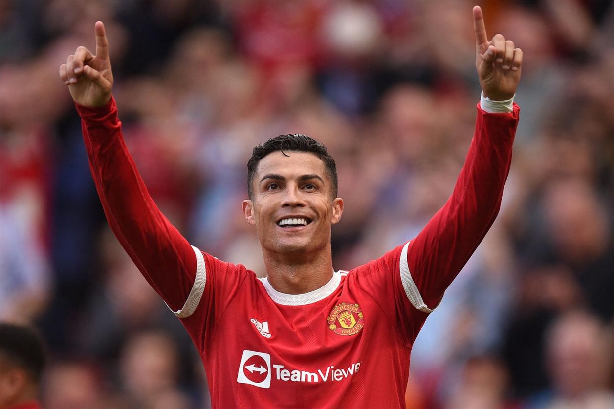 TOPSHOT - Manchester United's Portuguese striker Cristiano Ronaldo celebrates after scoring their second goal during the English Premier League football match between Manchester United and Newcastle at Old Trafford in Manchester, north west England, on September 11, 2021. - RESTRICTED TO EDITORIAL USE. No use with unauthorized audio, video, data, fixture lists, club/league logos or 'live' services. Online in-match use limited to 120 images. An additional 40 images may be used in extra time. No video emulation. Social media in-match use limited to 120 images. An additional 40 images may be used in extra time. No use in betting publications, games or single club/league/player publications. (Photo by Oli SCARFF / AFP) / RESTRICTED TO EDITORIAL USE. No use with unauthorized audio, video, data, fixture lists, club/league logos or 'live' services. Online in-match use limited to 120 images. An additional 40 images may be used in extra time. No video emulation. Social media in-match use limited to 120 images. An additional 40 images may be used in extra time. No use in betting publications, games or single club/league/player publications. / RESTRICTED TO EDITORIAL USE. No use with unauthorized audio, video, data, fixture lists, club/league logos or 'live' services. Online in-match use limited to 120 images. An additional 40 images may be used in extra time. No video emulation. Social media in-match use limited to 120 images. An additional 40 images may be used in extra time. No use in betting publications, games or single club/league/player publications. (Photo by OLI SCARFF/AFP via Getty Images)