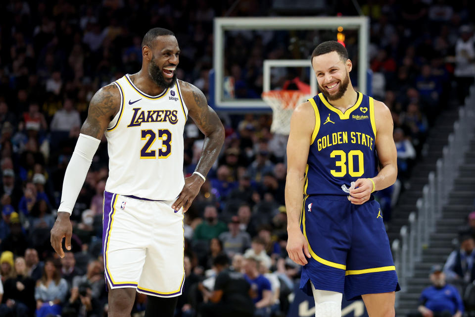SAN FRANCISCO, CALIFORNIA - JANUARY 27: Stephen Curry #30 of the Golden State Warriors and LeBron James #23 of the Los Angeles Lakers joke around with one another during their game at Chase Center on January 27, 2024 in San Francisco, California. NOTE TO USER: User expressly acknowledges and agrees that, by downloading and or using this photograph, User is consenting to the terms and conditions of the Getty Images License Agreement.  (Photo by Ezra Shaw/Getty Images)