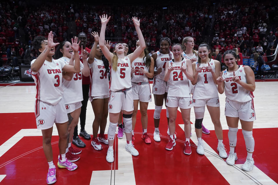 Utah players celebrate a victory over Gardner-Webb in a first-round college basketball game in the women's NCAA Tournament, Friday, March 17, 2023, in Salt Lake City. (AP Photo/Rick Bowmer)
