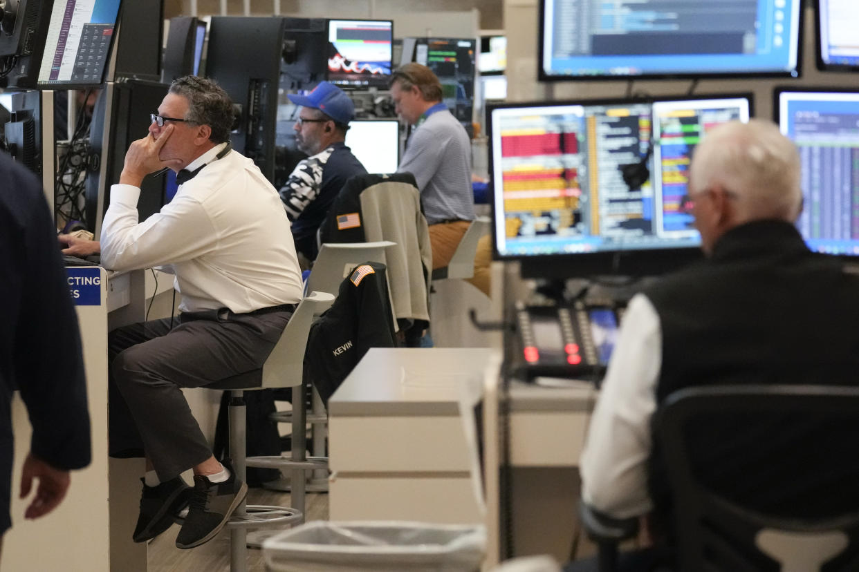 Traders work on the floor at the New York Stock Exchange in New York, Friday, June 2, 2023. (AP Photo/Seth Wenig)