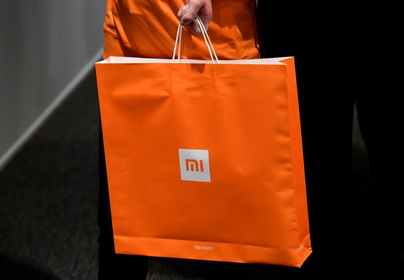 Xiaomi branding is seen on a carrier bag at a UK launch event in London