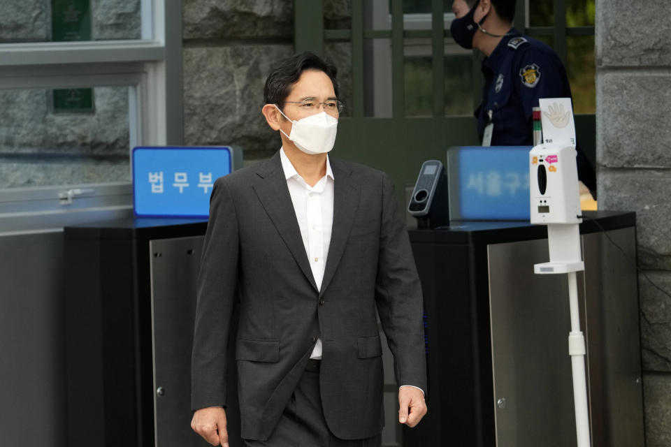 FILE - Samsung Electronics Vice Chairman Lee Jae-yong walks out from a detention center in Uiwang, South Korea, Aug. 13, 2021. South Korea's president will pardon billionaire Samsung heir Lee Jae-yong a year after he was released on parole after serving 18 months in prison over his involvement in a massive corruption scandal that triggered waves of protests and toppled a presidency. The decision by President Yoon Suk Yeol was announced by his justice minister on Friday, Aug. 12, 2022. (AP Photo/Lee Jin-man, File)