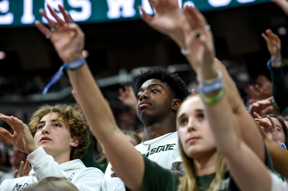 Michigan State football quarterback Aidan Chiles takes in the game from the Izzone during the first half in the game against Minnesota on Thursday, Jan. 18, 2024, at the Breslin Center in East Lansing.