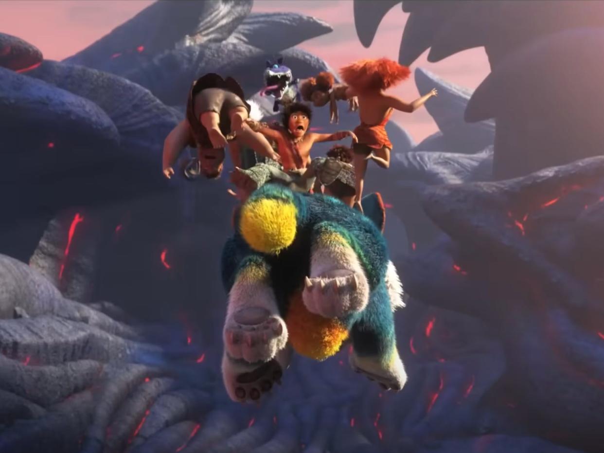 The Crood family flying through the sky in the animated film “The Croods: A New Age.”