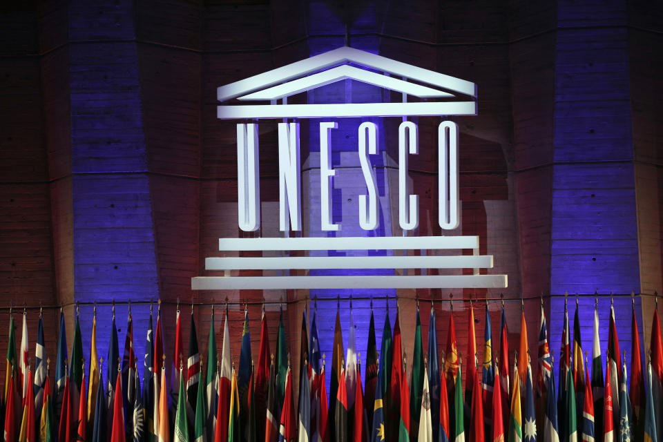 FILE - The logo of the United Nations Educational, Scientific and Cultural Organisation (UNESCO) is seen during the 39th session of the General Conference at the UNESCO headquarters in Paris, Nov. 4, 2017. First lady Jill Biden will join other VIPs and speak at a ceremony Tuesday, July 25, 2023, at the headquarters of the United Nations Scientific, Educational and Cultural Organization. The American flag will be raised to mark the U.S. return to membership after a five-year absence. (AP Photo/Christophe Ena, File)