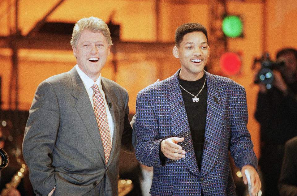 Bill Clinton chats with comedian-actor Will Smith at the Presidential Inaugural Celebration for Youth on January 17, 1993. (AP Photo/Greg Gibson)