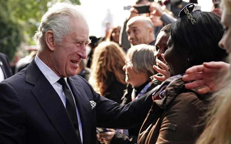 King Charles III talking with members of the public on September 17 - AARON CHOWN/AFP