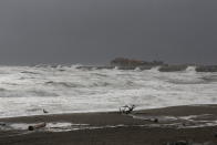 Waves from the Bering Sea splash up on a jetty on Friday, Sept. 16, 2022, in Nome, Alaska. Much of Alaska's western coast could see flooding and high winds as the remnants of Typhoon Merbok moved into the Bering Sea region. The National Weather Service says some locations could experience the worst coastal flooding in 50 years. (AP Photo/Peggy Fagerstrom)