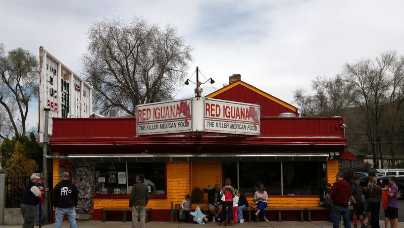 People wait to be seated at Red Iguana. 