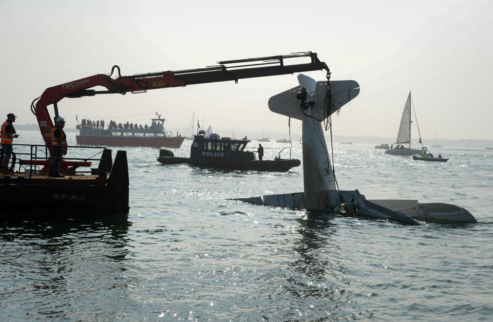 <p>POOLE, ENGLAND - SEPTEMBER 05: The AeroSuperBatics Wing walker plane is raised from the seabed on September 5, 2021 in Poole, England. Bournemouth Air Festival suspended flying yesterday after a light aircraft crashed into Poole Harbour injuring two crew. (Photo by Finnbarr Webster/Getty Images)</p>
