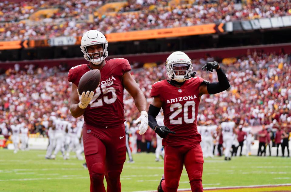 Arizona Cardinals linebacker Zaven Collins (25) and Arizona Cardinals cornerback Marco Wilson (20) react after a turnover against the Washington Commanders at FedExField on Sept. 10, 2023, in Landover, Maryland.