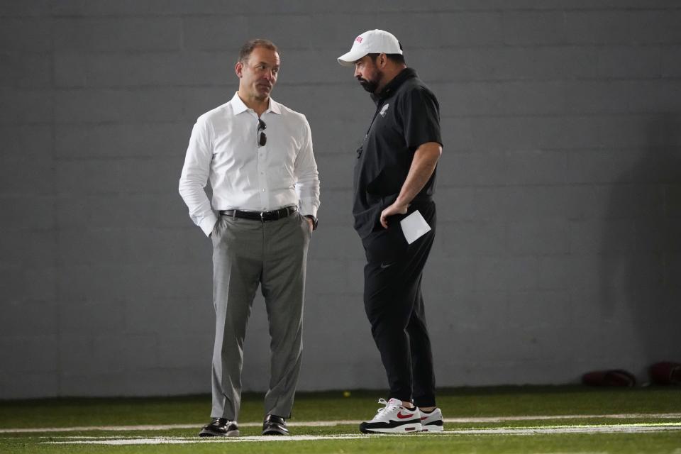 Mar 5, 2024; Columbus, OH, USA; Ohio State Buckeyes head coach Ryan Day talks to incoming athletic director Ross Bjork during the first spring practice at the Woody Hayes Athletic Center.