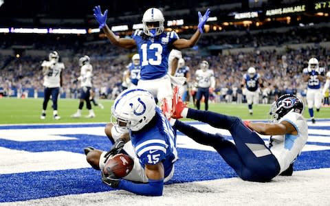 Wide receiver T.Y. Hilton #13 of the Indianapolis Colts celebrates after wide receiver Dontrelle Inman #15 scores a touchdown in the fourth quarter of the game against the Tennessee Titans  - Credit: Getty