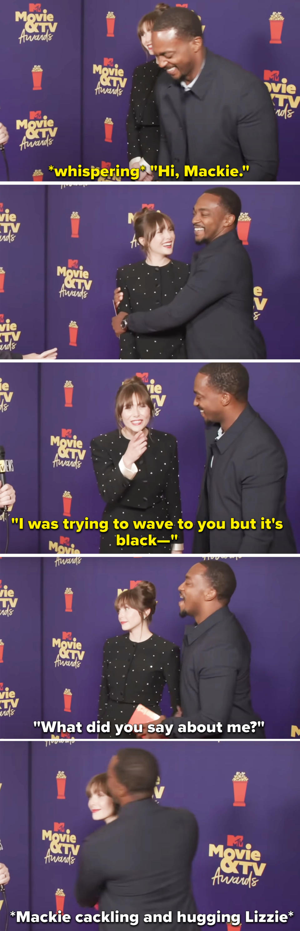 Elizabeth Olsen and Anthony Mackie hugging on the red carpet.