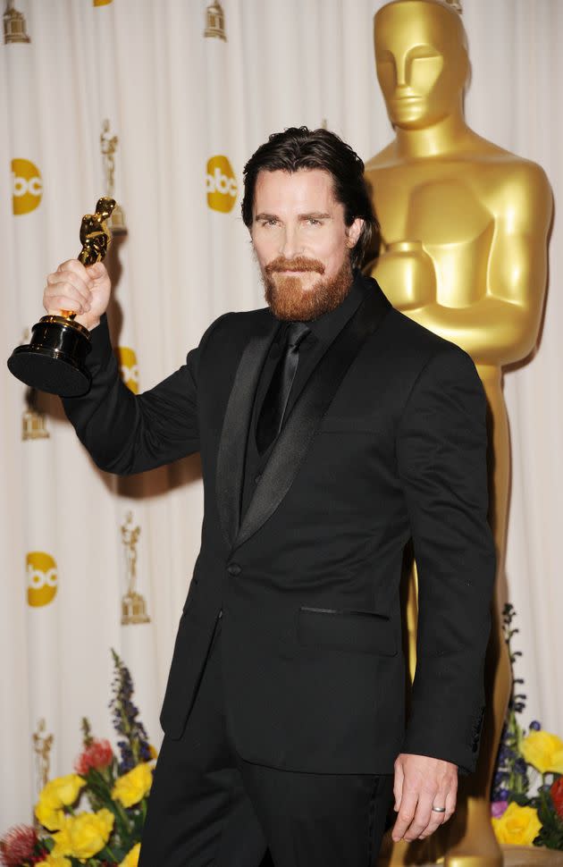 Christian Bale holds his Oscar statue after winning for his role in The Fighter. (Photo: Getty Editorial)