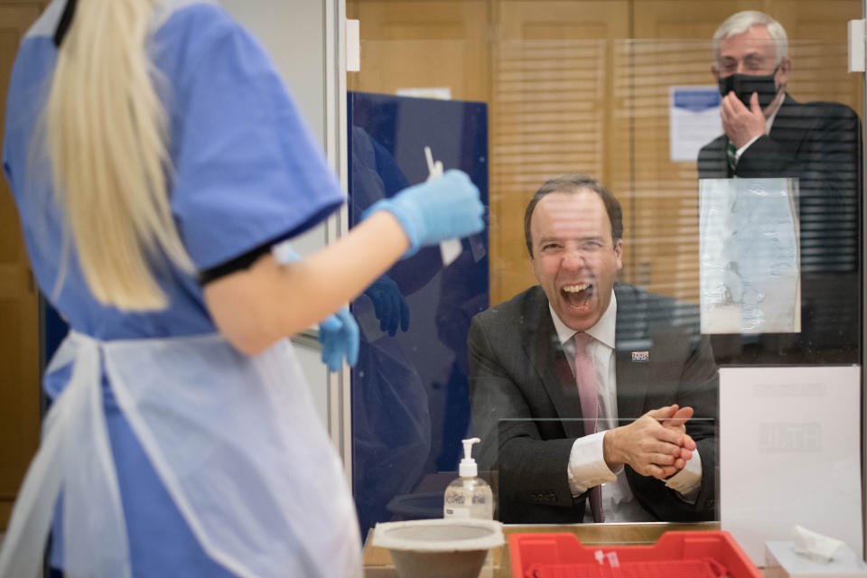 Health Secretary Matt Hancock takes a coronavirus test at a new Covid-19 testing facility in the Houses of Parliament in London watched by the Speaker of the House of Commons, Sir Lindsay Hoyle. The voluntary walk-in test centre has been set up for MPs and parliament staff who have to travel into their offices in Westminster. Picture date: Tuesday February 2, 2021.