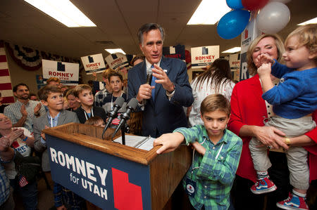 Republican U.S. senate candidate Mitt Romney reacts surrounded by his grandchildren and wife, Ann, at his election night party in Orem, Utah, U.S. November 6, 2018. REUTERS/Ed Kosmicki