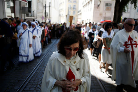People take part in the Saint Anthony procession in Lisbon, Portugal, June 13, 2018. Picture taken June 13, 2018. REUTERS/Pedro Nunes