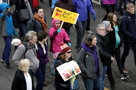 People demonstrate during a "March For Our Lives" demonstration demanding gun control in Seattle, Washington, U.S. March 24, 2018. REUTERS/Jason Redmond