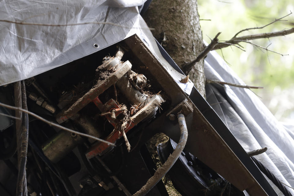 A view of a clamp that was placed on an emergency brake, as search for evidence continues in the wreckage of a cable car after it collapsed near the summit of the Stresa-Mottarone line in the Piedmont region, northern Italy, Wednesday, May 26, 2021. Police have made three arrests in the cable car disaster that killed 14 people after an investigation showed a clamp, placed on the brake as a patchwork repair effort, prevented the brake from engaging after the lead cable snapped. (AP Photo/Luca Bruno)